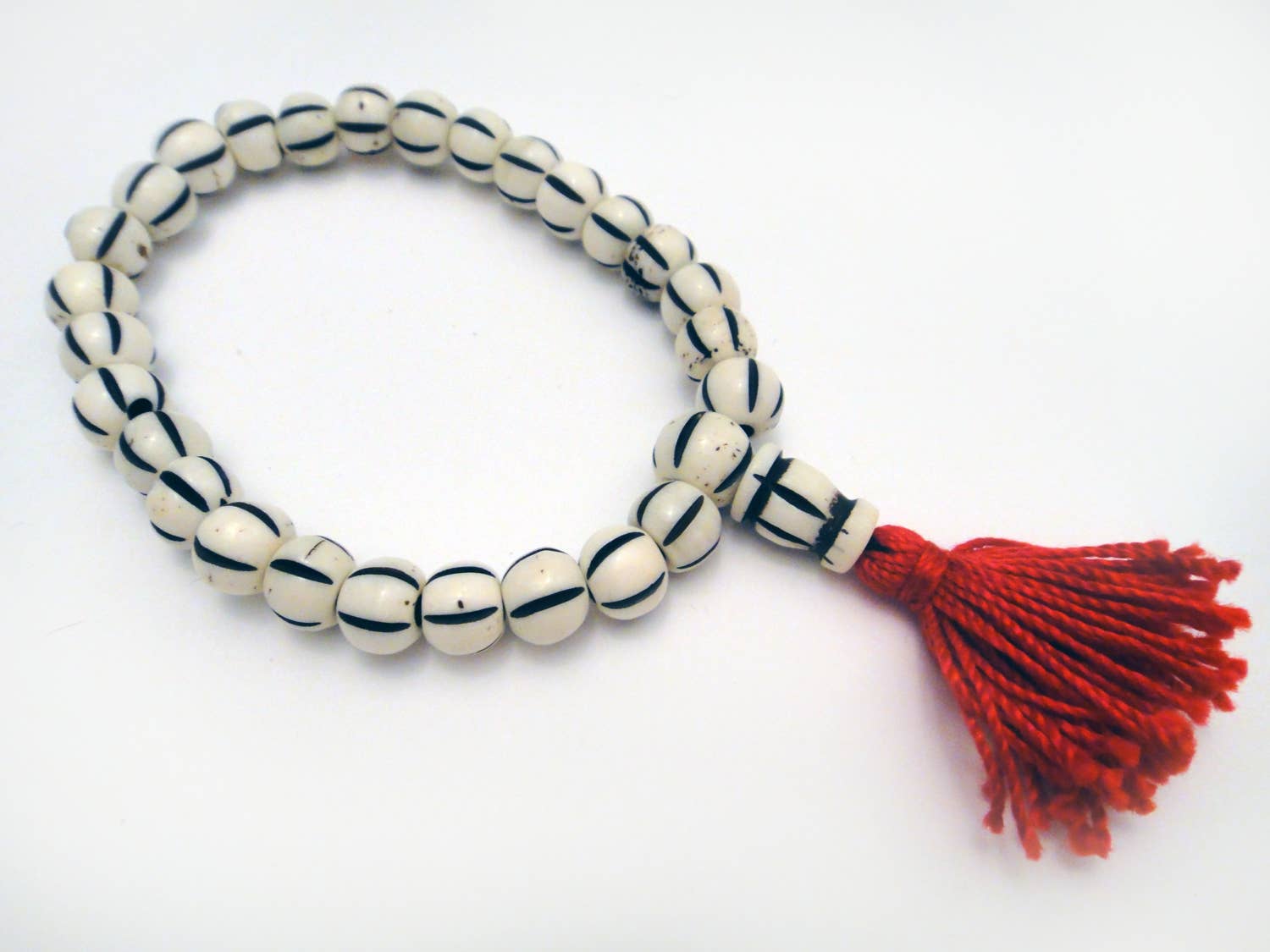 Tika Bracelet Carved Bone Mala Bracelet- Light Striped