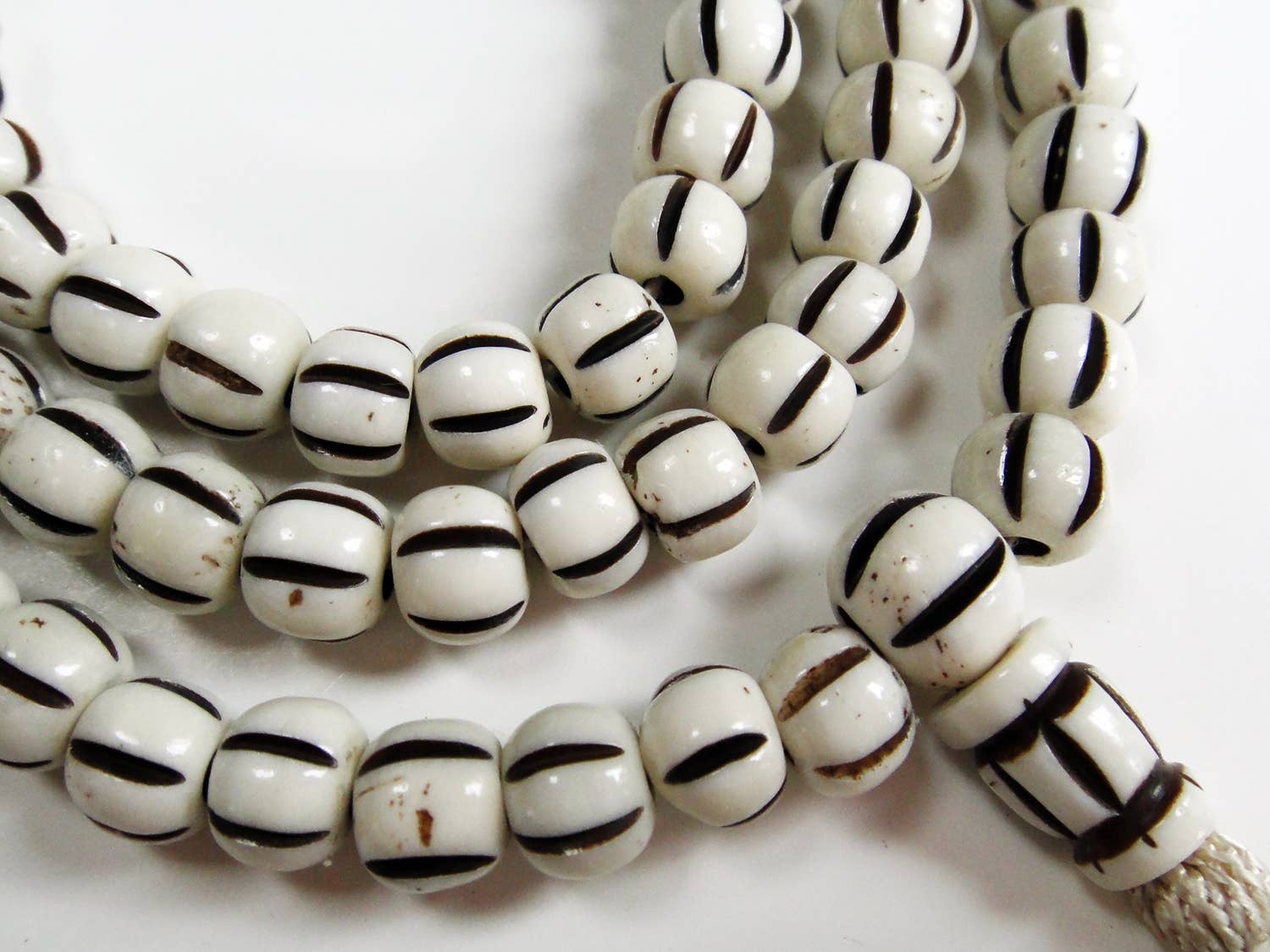 Tika Bracelet Carved Bone Mala- Light Striped